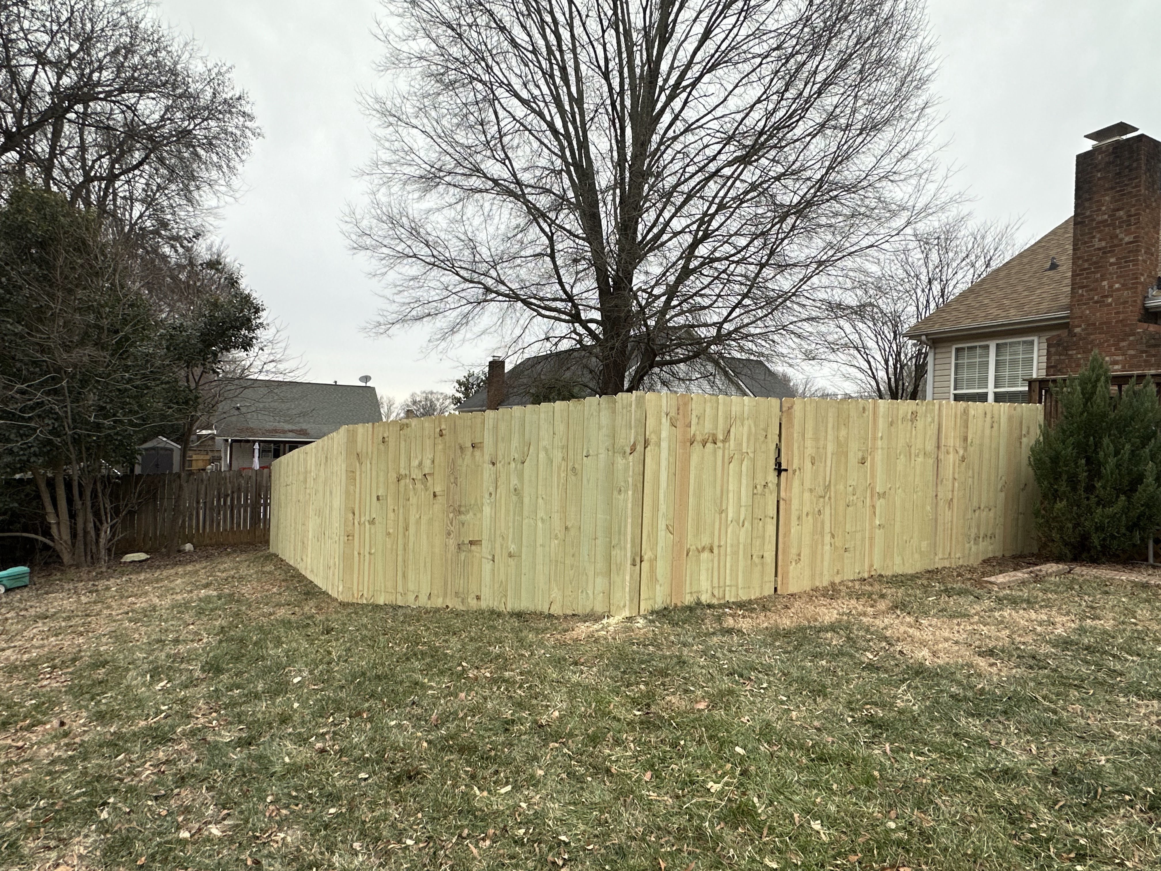 Wood privacy fence and gate on a residential property